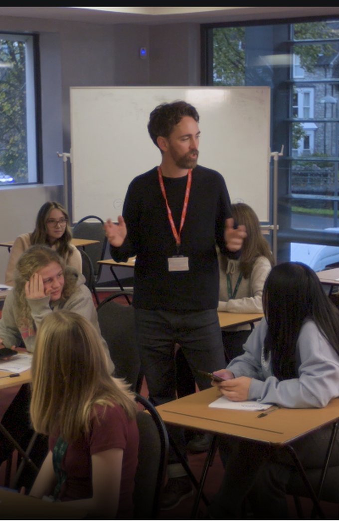 A teacher leading a lesson with a class of students